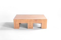 Side profile of a six leg coffee table highlighting its veneer finish
