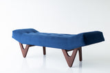 Modern luxury Alaska upholstered bench on sculptural hand-shaped walnut legs by Craft Associates, front view
