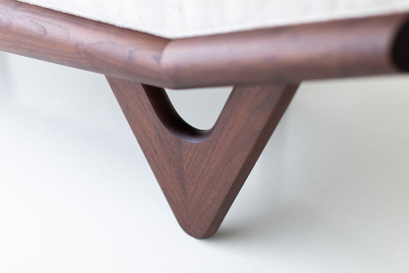 Modern luxury Alaska upholstered walnut wood bench styled at the foot of a bed