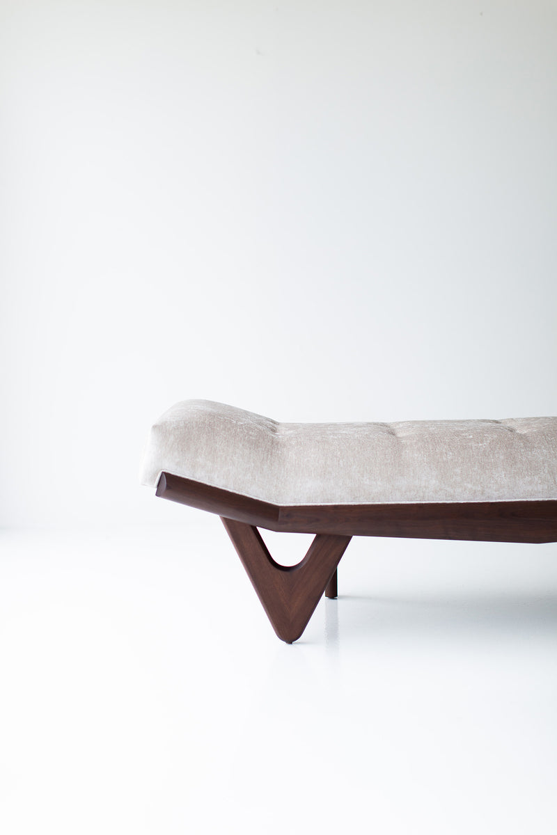 Angled view of the modern luxury Alaska wood bench highlighting its hand-shaped solid walnut base