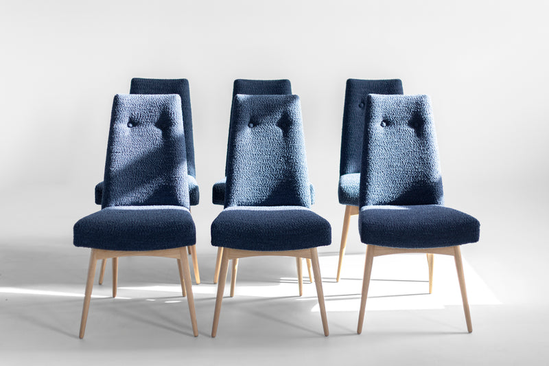 Modern luxury Alto upholstered dining chair in solid walnut by Craft Associates, tall sculptural back, front view
