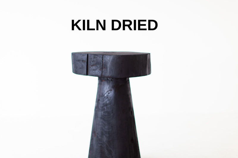 Organic modern burnt wood stump table, fully charred red cedar, front view
