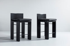 Close-up of the black leather texture on a Chile counter stool