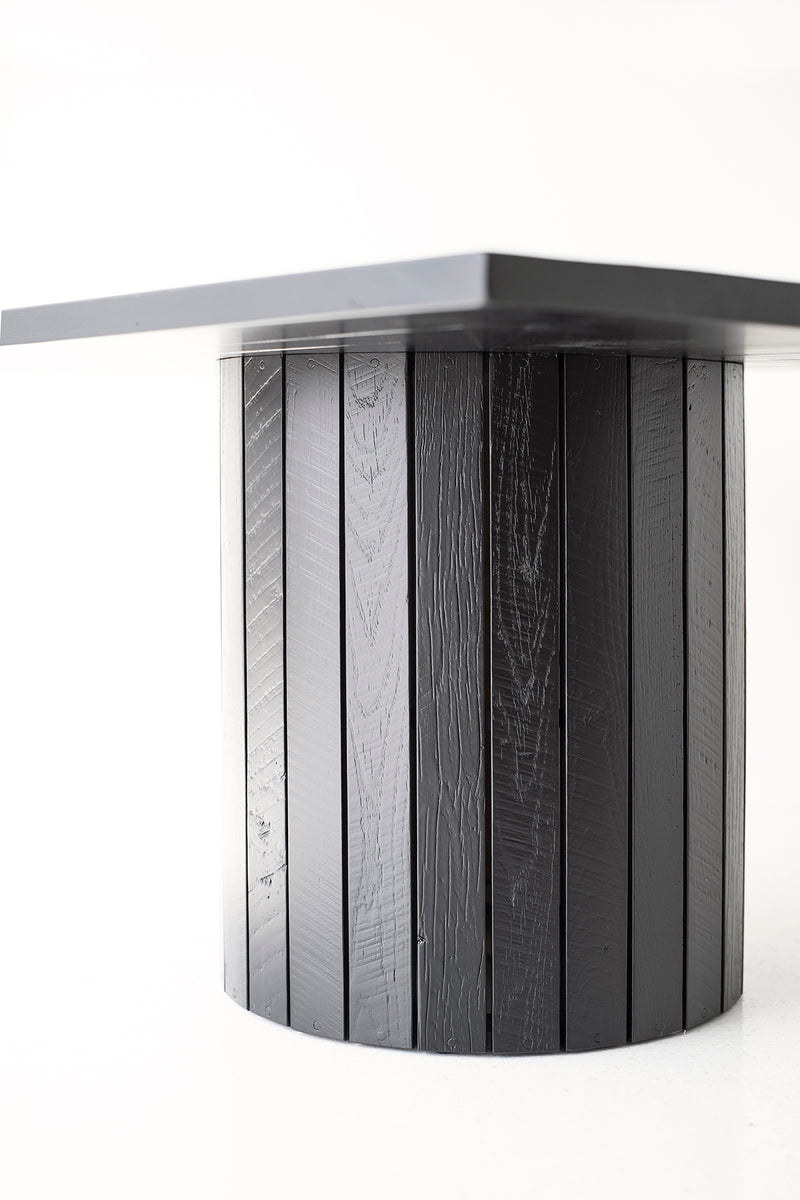 Front view of a Bellhop dining table showing its crisp rectangular top
