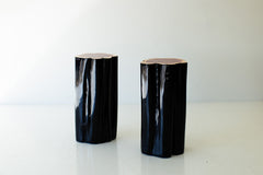 Two black outdoor red cedar stump tables with natural tops