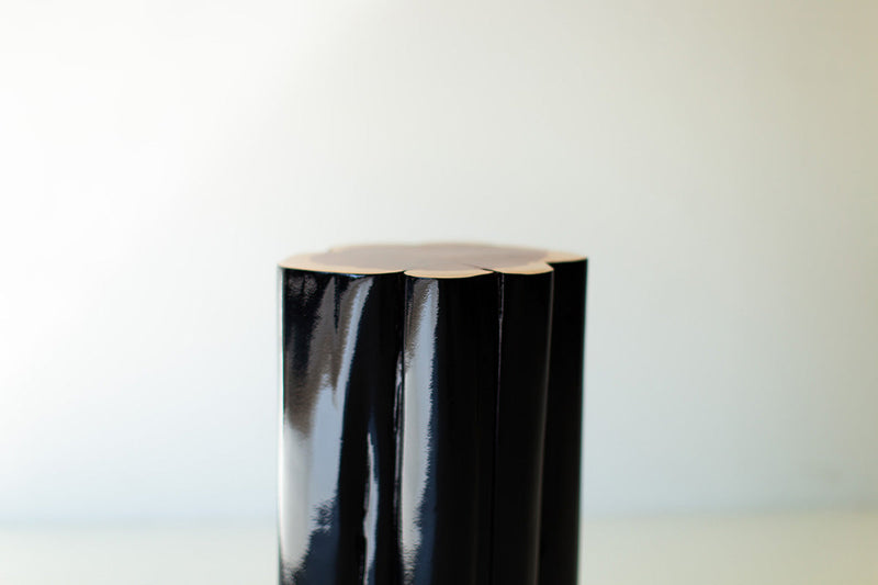 Glossy black outdoor stump table with natural top, close view