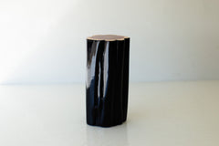 Black outdoor stump table with natural top, front view