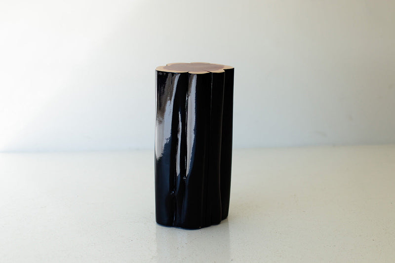 Black outdoor stump table with natural top, front view