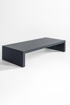 Blackened oak coffee table styled with books and decor on top