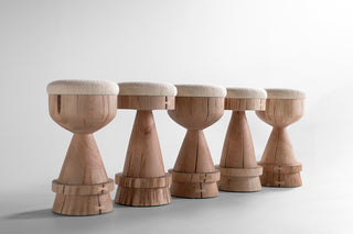Organic modern maple counter stool, hand-sculpted from a solid trunk, with a bouclé seat