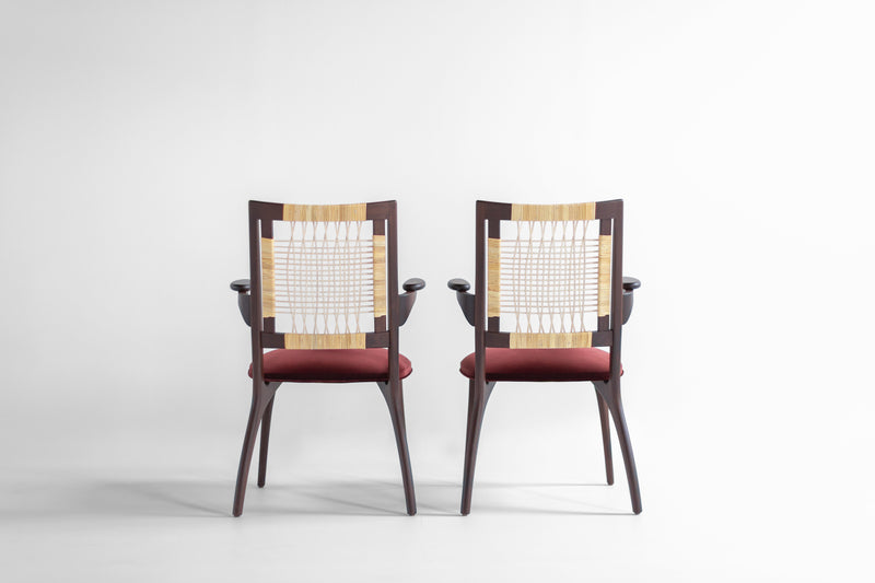 Angled view of the modern luxury Bonnie walnut arm chair showing its commercial-grade matte finish