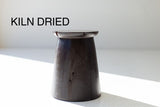 Organic modern hand-sculpted maple stump stool in an aged finish, front view
