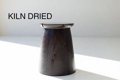 Organic modern hand-sculpted maple stump stool in an aged finish, front view