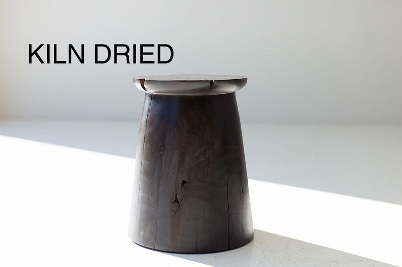 Organic modern hand-sculpted maple stump stool in an aged finish, front view