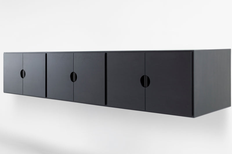 Close-up of the walnut wood grain and matte finish on a floating unit