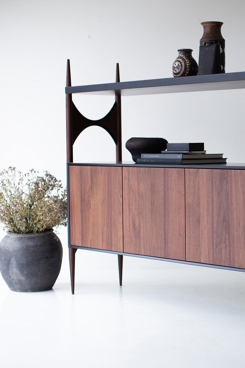 Close-up of the fluid arched walnut door fronts on the modern luxury Cambre credenza