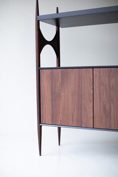 Interior view of the modern luxury Cambre credenza's open walnut shelving