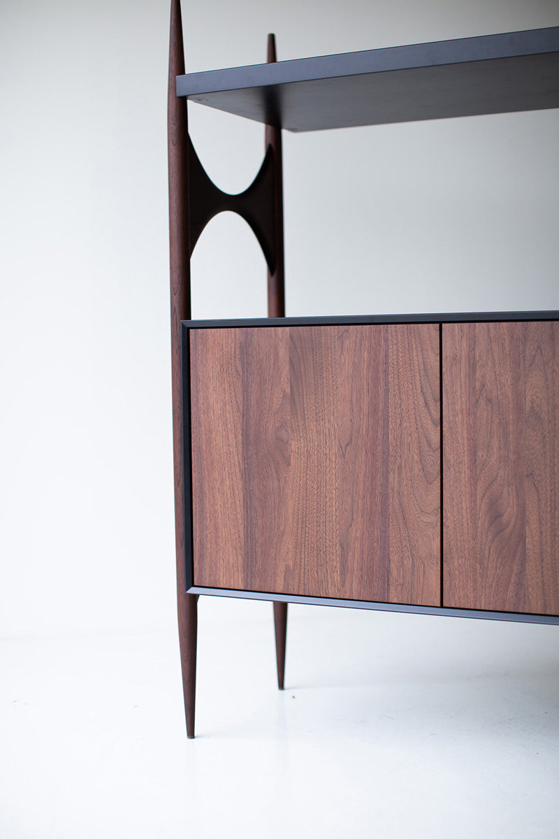 Interior view of the modern luxury Cambre credenza's open walnut shelving