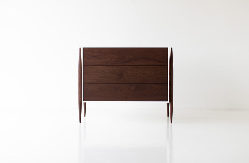 Modern luxury walnut Cambre dresser styled in a bedroom