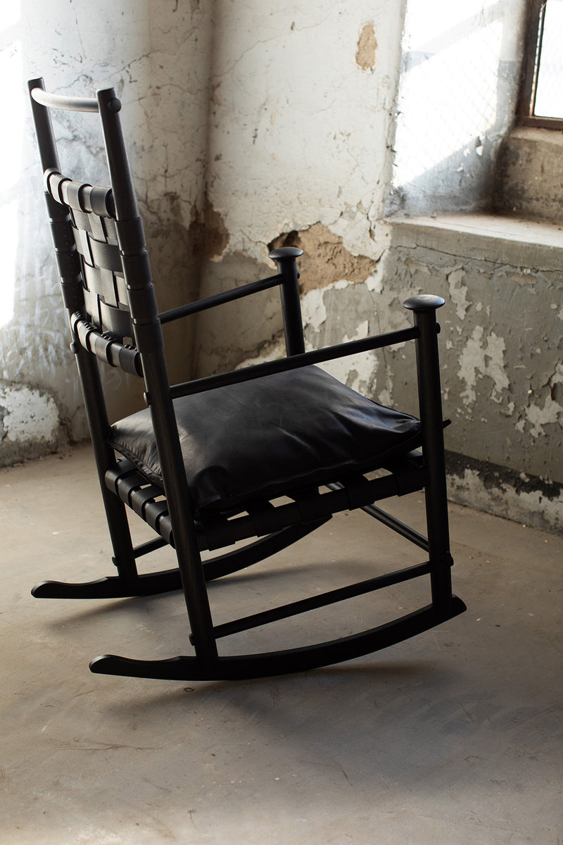 Close-up of the supple black leather seat and back cushions on the modern luxury Catawba rocking chair