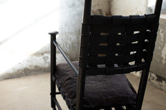 Modern luxury Catawba black leather rocking chair styled in a modern living room