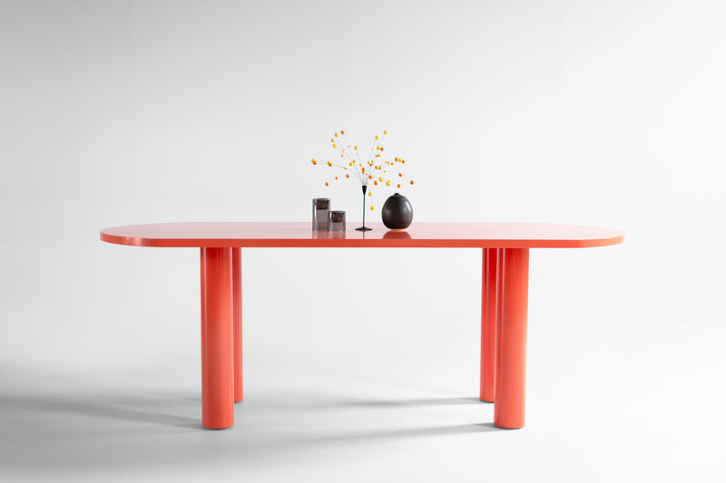 Modern luxury Cava dining table in bright coral high-gloss lacquer, front view