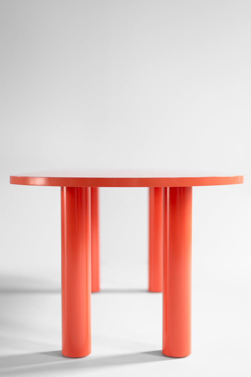 Angled view highlighting the Cava table's chunky, sculptural legs