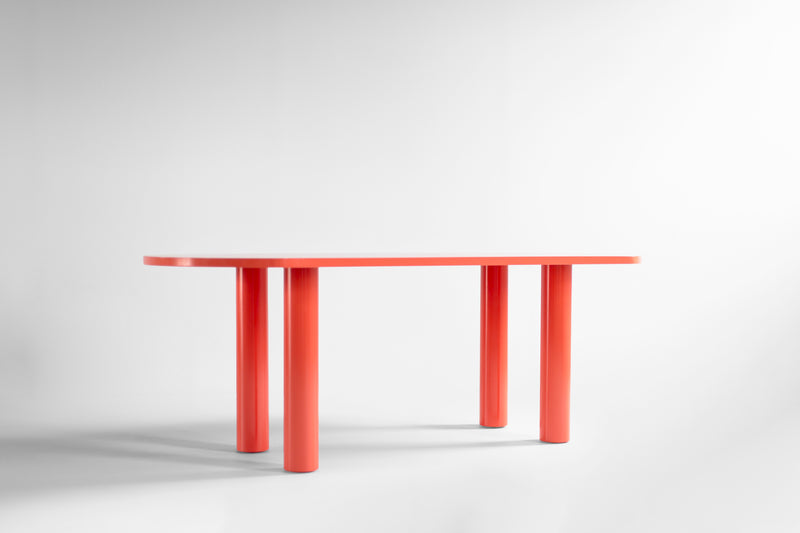 Side profile showing the bold coral color and clean lines