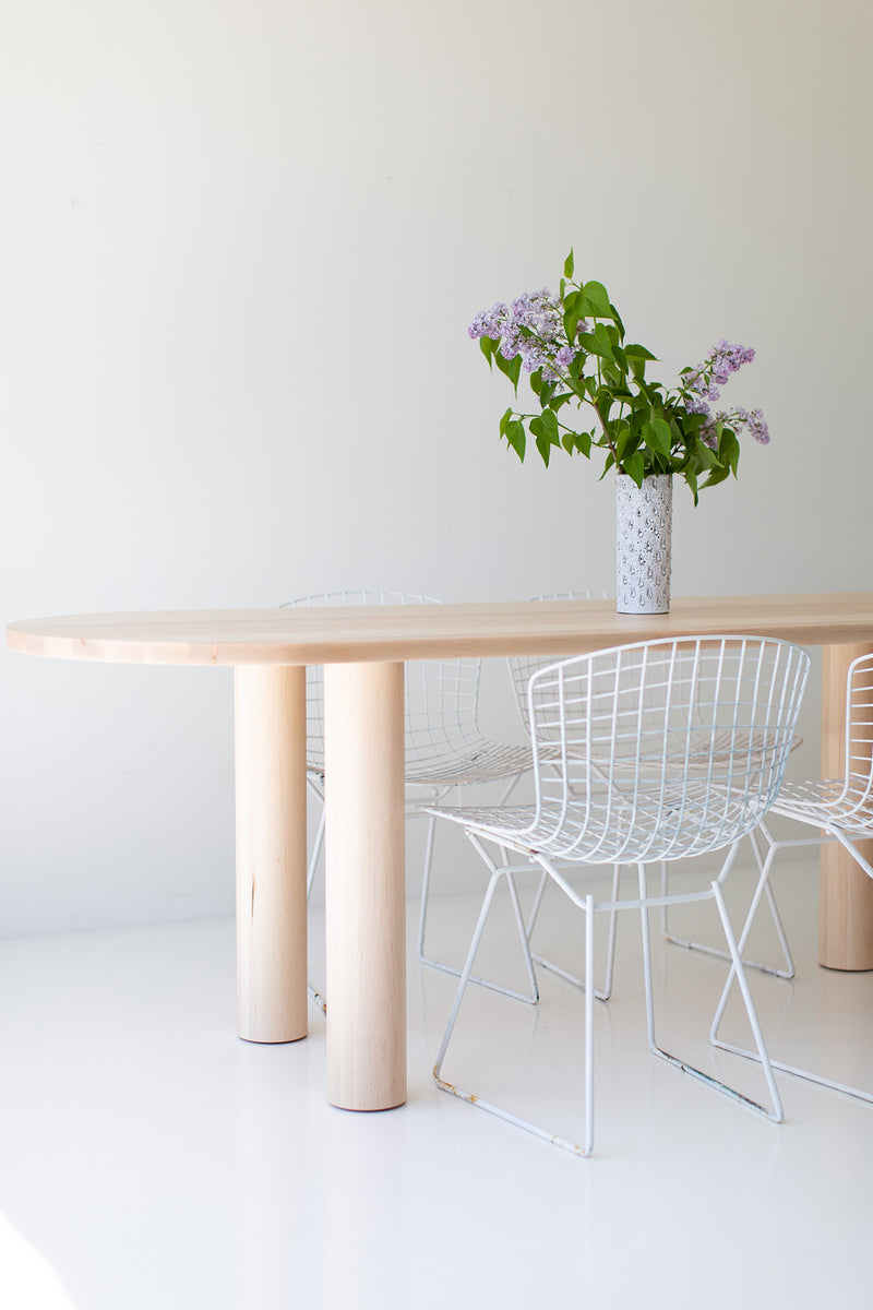 Angled view of the Cava oval dining table highlighting its length and clean lines