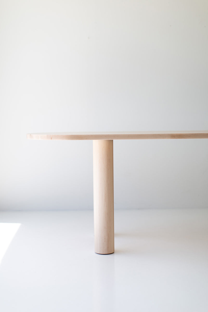 Detail shot of the Cava oval table's pedestal base construction