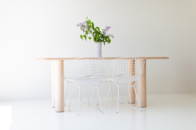 Close-up of the smooth clear finish on the Cava oval dining table
