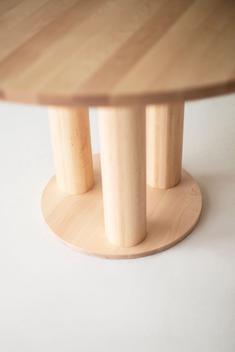 Close-up of the hand-selected maple grain on the Cava round dining table