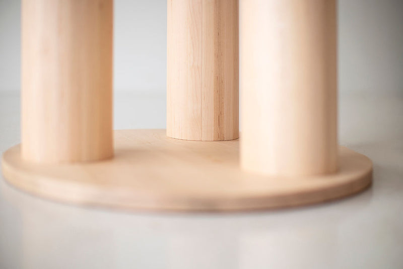 Angled view of the Cava dining table highlighting the clear commercial-grade finish