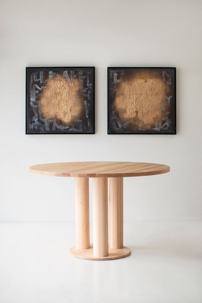 Detail shot of the Cava table's pedestal base and where it meets the tabletop