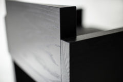 Side profile of a Chile counter stool highlighting its black metal rod frame