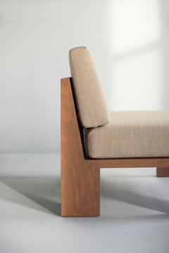 Front view of a Chile lounge chair showing its greywash wood frame