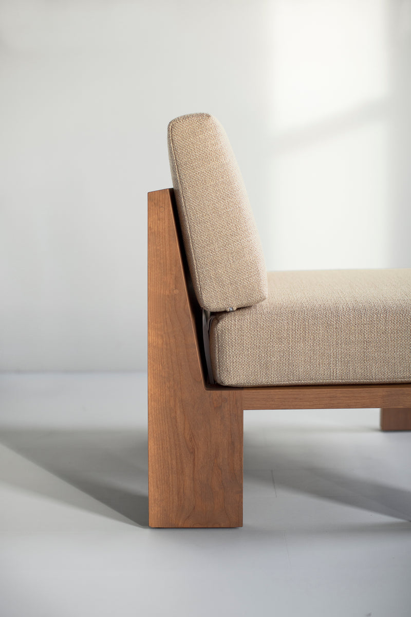 Front view of a Chile lounge chair showing its greywash wood frame