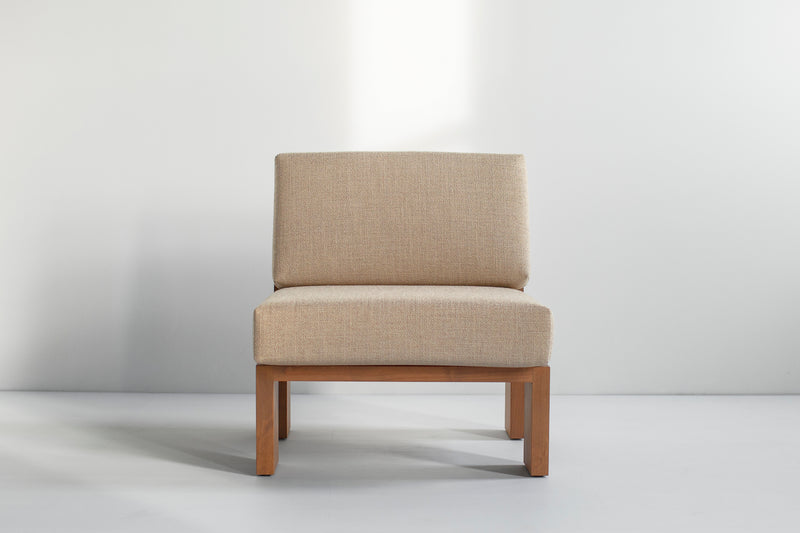 Close-up of the thick weave fabric cushion on a greywash lounge chair