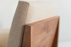 Angled view of a Chile lounge chair showing its knotty alder wood detail