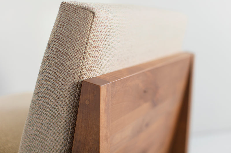 Angled view of a Chile lounge chair showing its knotty alder wood detail