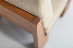 Full view of a Chile lounge chair in greywash against a white backdrop