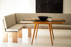 Modern luxury white oak banquette in a bright dining space