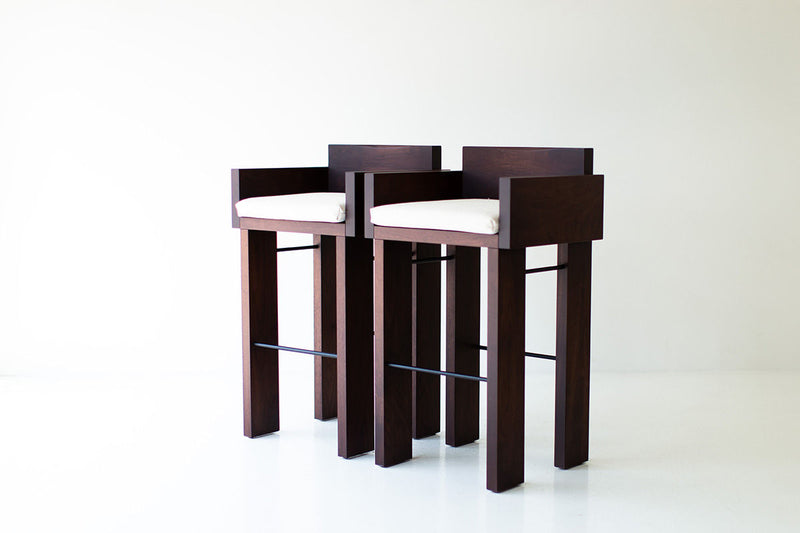 Modern luxury walnut bar stool with arms and black metal rods, the Chile from Bertu Home