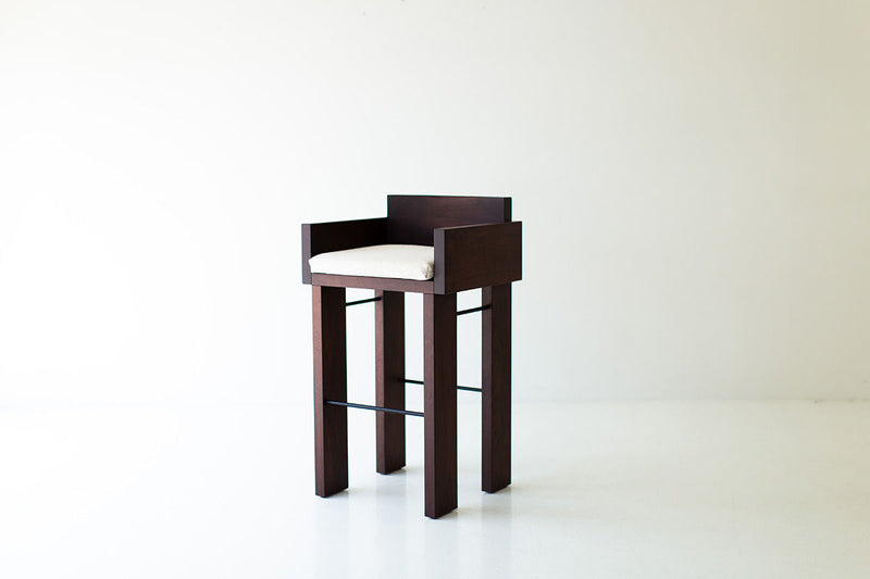 Detail of the black metal rod joinery on the walnut Chile bar stool