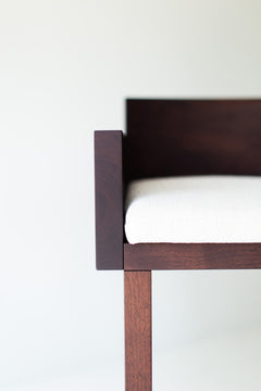 Walnut grain detail along the frame of the Chile bar stool