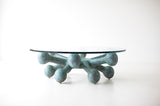 Craft Associates modern bronze coffee table with glass top, front view