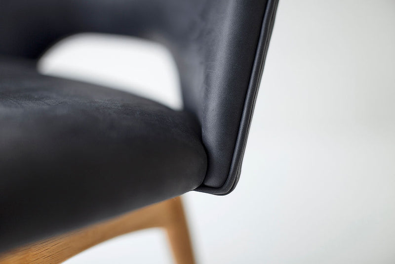 Close-up of the leather upholstery and oak frame on an executive chair
