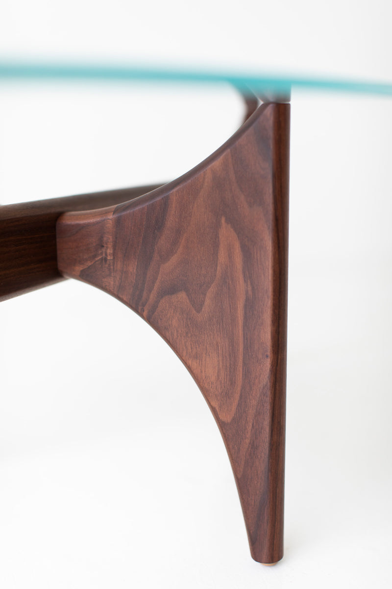 Close-up detail of the teak wood grain on the oval coffee table