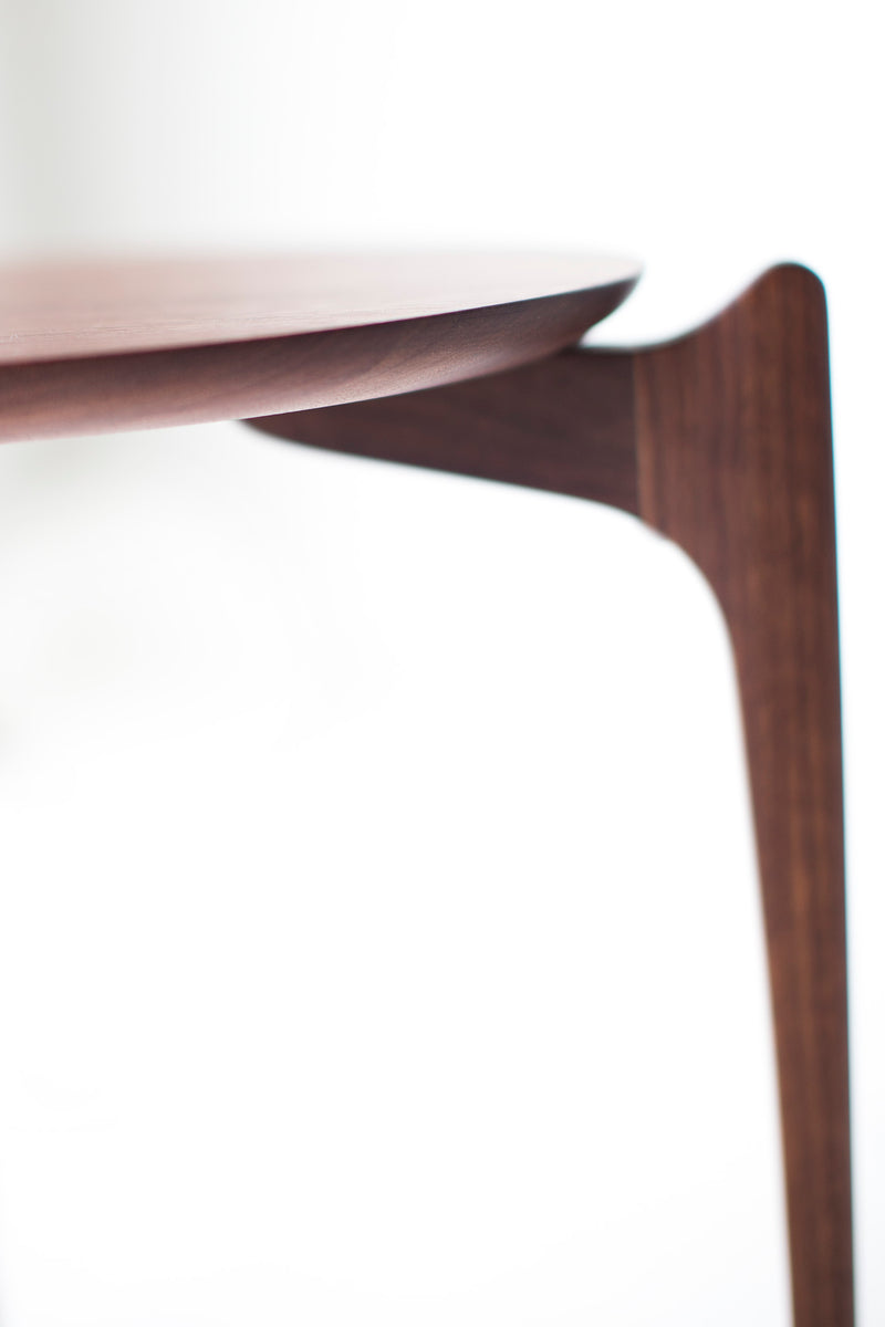 Angled view of the walnut stacking side tables