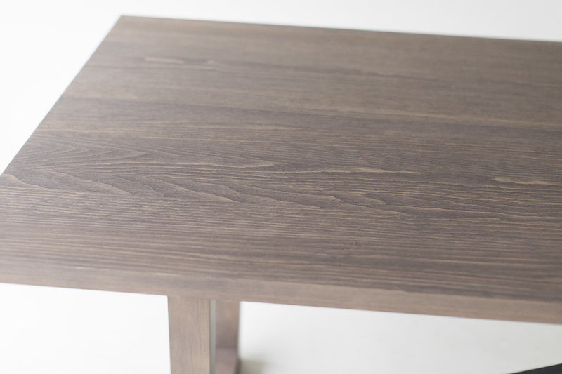 Angled view of the distressed grey dining table